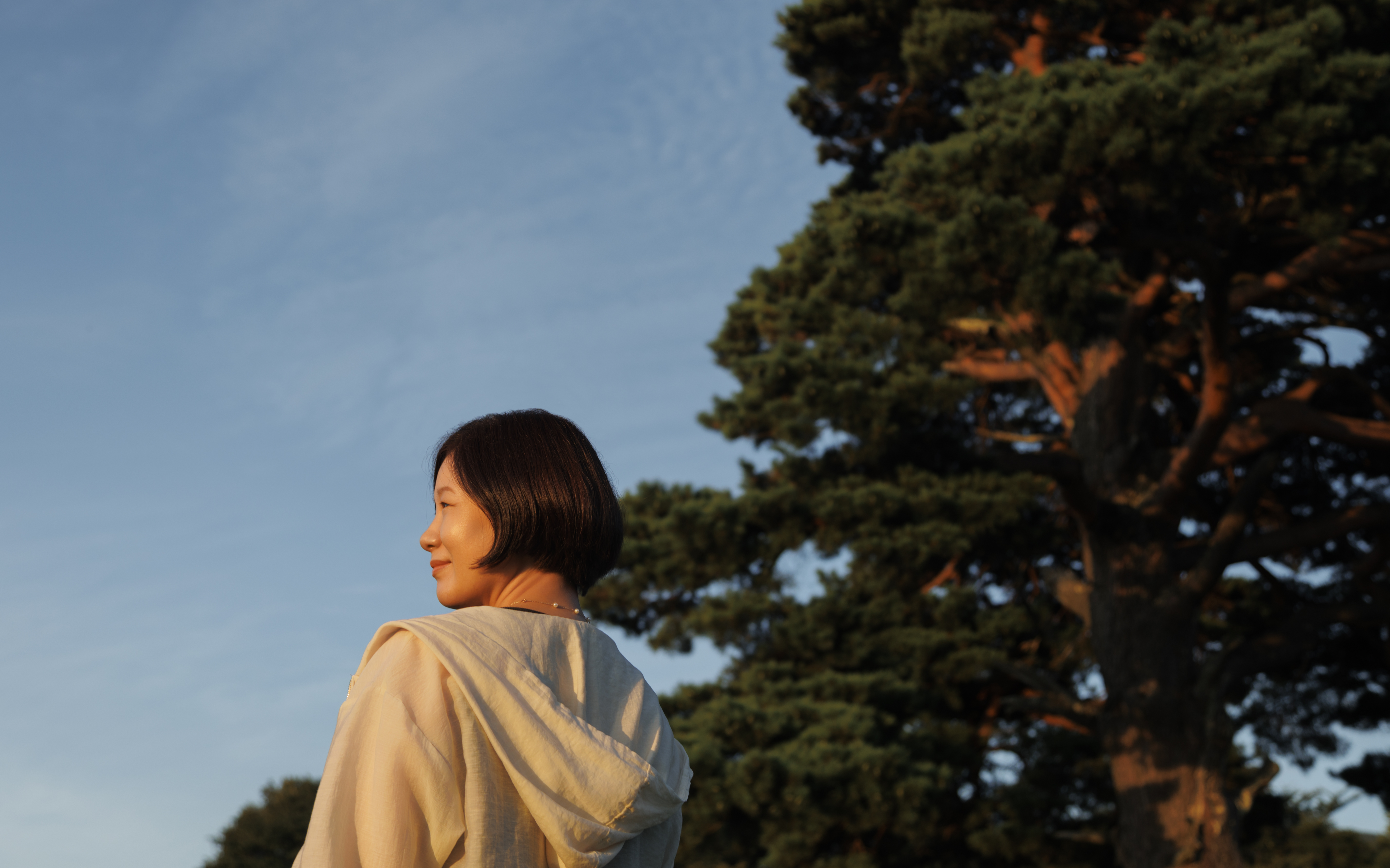 A participant outdoors at golden hour